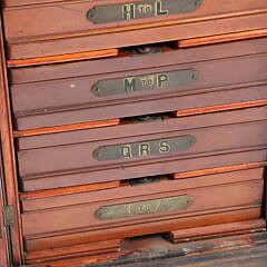 Vintage Mahogany Seven Drawer Collector’s Cabinet with Brass Alphabet Labeled Drawers