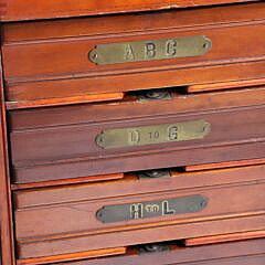 Vintage Mahogany Seven Drawer Collector’s Cabinet with Brass Alphabet Labeled Drawers