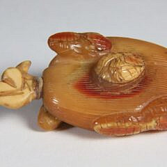 Carved Amber “Huasheng” Snuff Bottle, Qing Dynasty