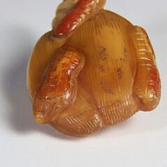 Carved Amber “Huasheng” Snuff Bottle, Qing Dynasty