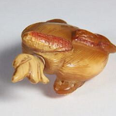Carved Amber “Huasheng” Snuff Bottle, Qing Dynasty