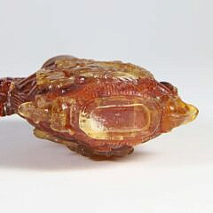 Carved Amber “Hotei and Shoulao” Snuff Bottle, Qing Dynasty