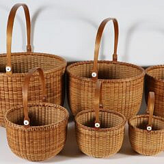 Nest of 10 Ainsley D. Rockwood Round Swing Handle Nantucket Baskets
