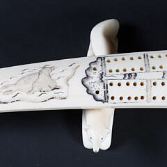 Inuit Carved and Scrimshaw Walrus Tusk Cribbage Board on Carved Wolf Feet