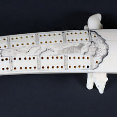 Inuit Carved and Scrimshaw Walrus Tusk Cribbage Board on Carved Wolf Feet