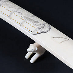 Inuit Carved and Scrimshaw Walrus Tusk Cribbage Board on Carved Wolf Feet