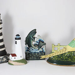 Four Cast Iron Doorstops: 2 Lighthouses, Pheasant, and Fish