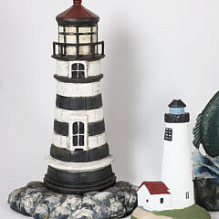 Four Cast Iron Doorstops: 2 Lighthouses, Pheasant, and Fish