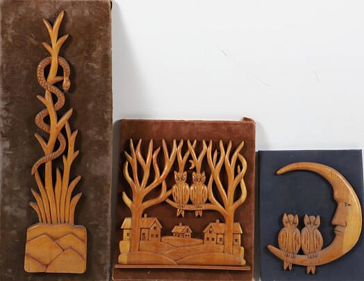 Group of Three Folk Art Carvings Mounted to Fabric Boards
