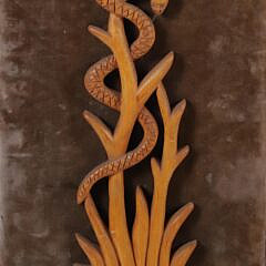Group of Three Folk Art Carvings Mounted to Fabric Boards