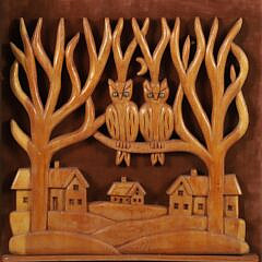 Group of Three Folk Art Carvings Mounted to Fabric Boards