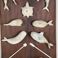 Vintage Folk Art Carved Bone Plaque with 20 Carved Artifacts of Sea Life and Tools