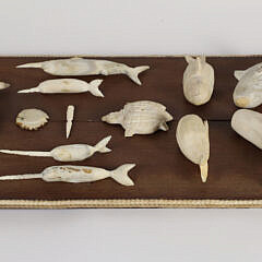 Vintage Folk Art Carved Bone Plaque with 20 Carved Artifacts of Sea Life and Tools