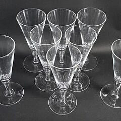 Set of Eight Signed Steuben Clear Glass Trumpet Form Champagne Glasses, 20th century