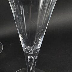 Set of Eight Signed Steuben Clear Glass Trumpet Form Champagne Glasses, 20th century