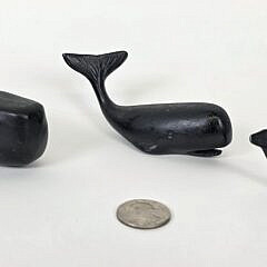 Three Cast Iron Graduating Sperm Whale Paper Weight Figurines, 20th century