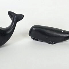 Three Cast Iron Graduating Sperm Whale Paper Weight Figurines, 20th century