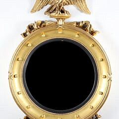 Regency Style Carved and Gilded Convex Mirror with Surmounted Spread Winged Eagle on a Plinth