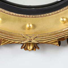 Regency Style Carved and Gilded Convex Mirror with Surmounted Spread Winged Eagle